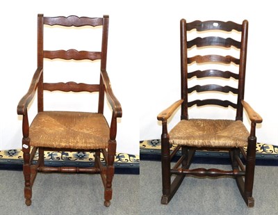 Lot 1164 - A 19th century elm ladder back rocking chair and an early 20th century oak rush seated open...