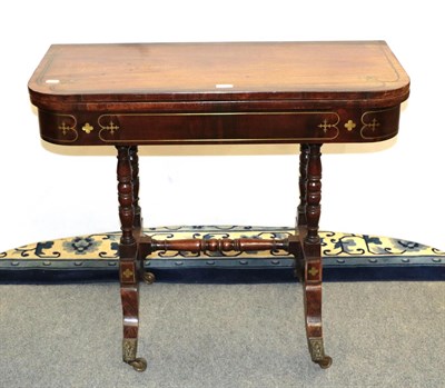 Lot 1166 - A 19th century rosewood and brass inlaid card table with swivel top and baize lined surface, moving