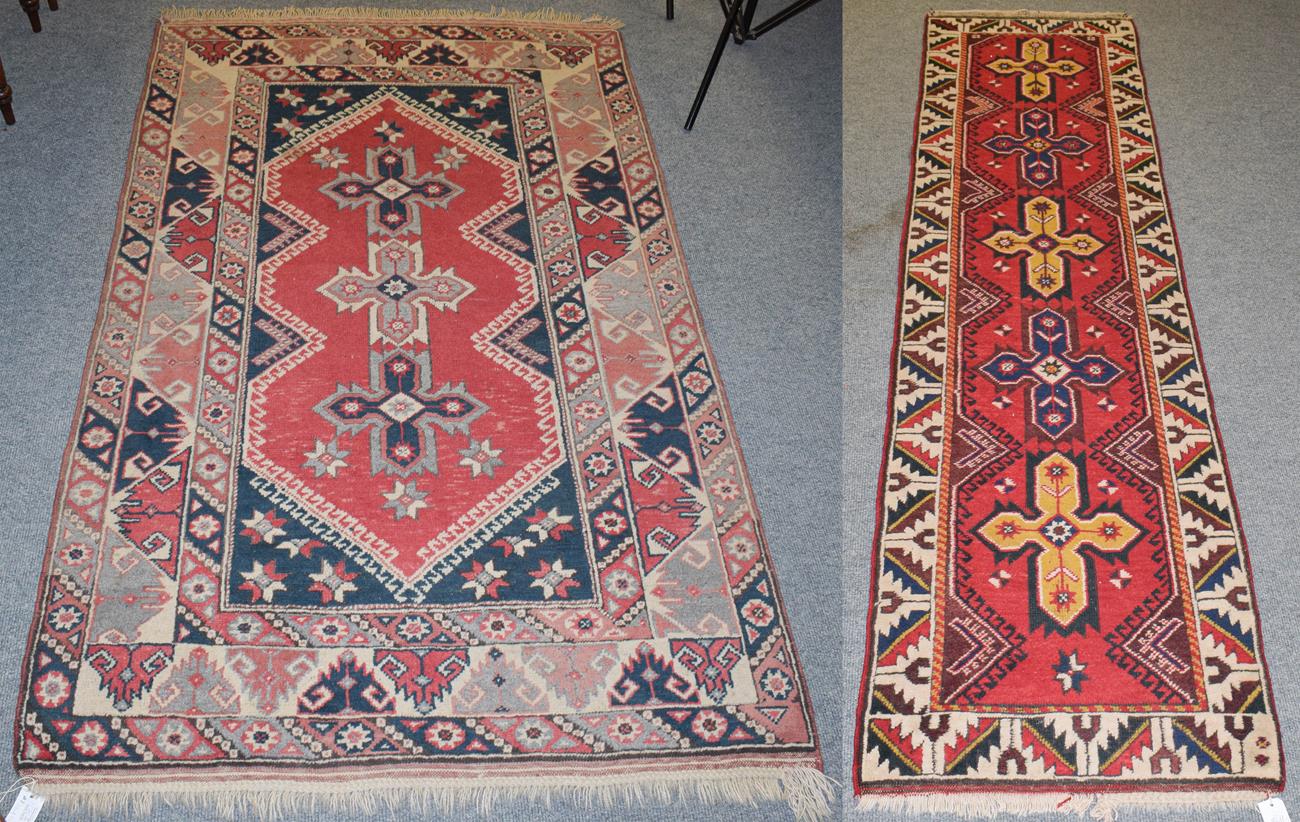 Lot 1170 - A Yagcibedir runner, 268cm by 70cm and another similar rug, 200cm by 122cm (2)