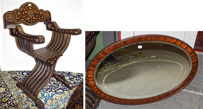 Lot 1172 - A 20th century bone inlaid savonarola chair, together with  a mahogany oval framed mirror,...