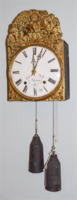 Lot 1180 - A 19th century French brass wall clock with enamel dial, striking on a bell and with pull repeater