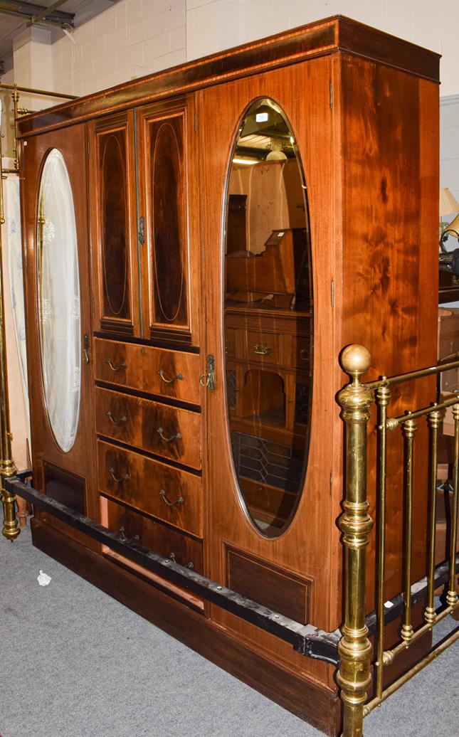Lot 1193 - An Edwardian inlaid mahogany mirrored double wardrobe, 178cm by 54cm by 200cm