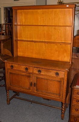 Lot 1202 - An oak dresser and rack, 122cm by 47cm by 192cm