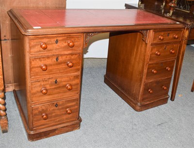 Lot 1204 - A late Victorian mahogany pedestal desk with red leather insert, 122cm by 60cm by 74cm