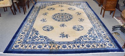 Lot 1222 - Chinese carpet the cream field with roundel medallion framed by borders of angular floral...