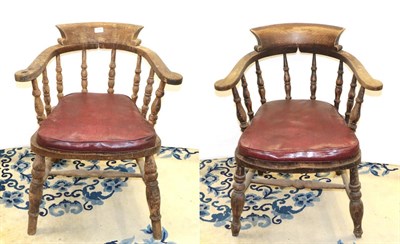 Lot 1236 - A pair of 19th century captain's chair / smoking chairs with red leather cushions
