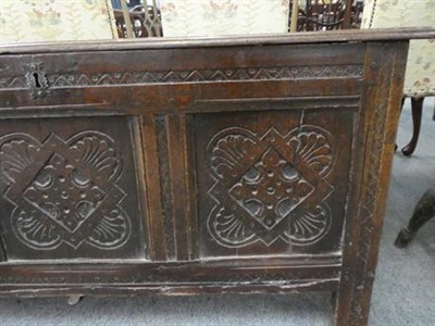 Lot 1238 - An 18th century carved oak three panel coffer, 115cm by 47cm by 58cm