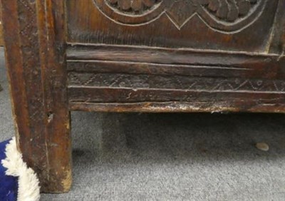 Lot 1238 - An 18th century carved oak three panel coffer, 115cm by 47cm by 58cm