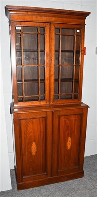 Lot 1252 - An Edwardian inlaid mahogany glazed bookcase cabinet of small proportions, 72cm by 30cm by 165cm