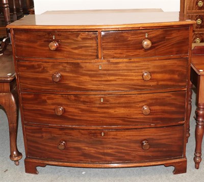 Lot 1256 - A 19th century mahogany bow front four high chest of drawers, 117cm by 59cm by 107cm