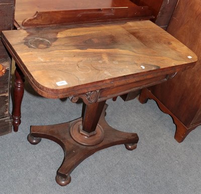 Lot 1280 - A Regency rosewood fold-over card table, with hexagonal pedestal and bun feet, 91.5cm by 45cm...
