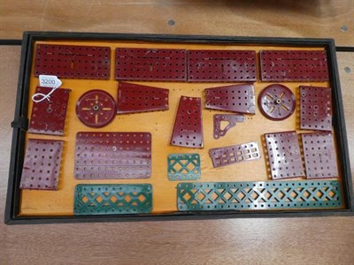 Lot 3200 - Meccano Engineering For Boys Outfit No.5 red/green parts strung onto original card inserts,...