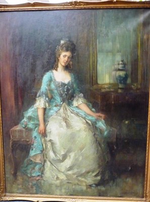 Lot 933 - J.. Edgar Mitchell (1871-1922) Fashionable young lady seated beside a mirror Signed, oil on canvas