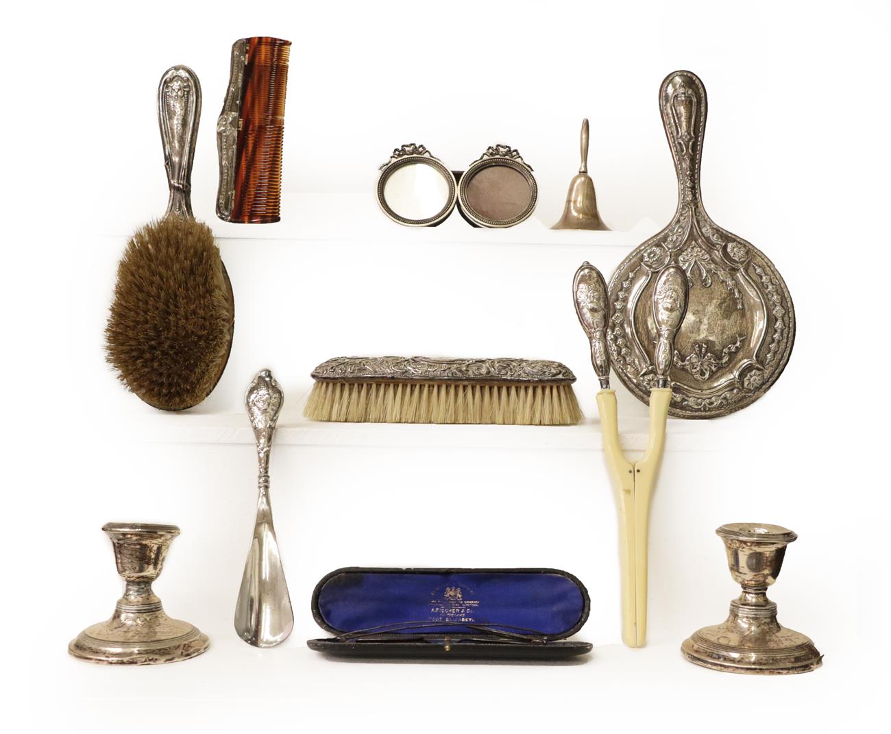Lot 5 - A tray of silver items including a pair of dwarf candlesticks, silver mounted spectacles case...