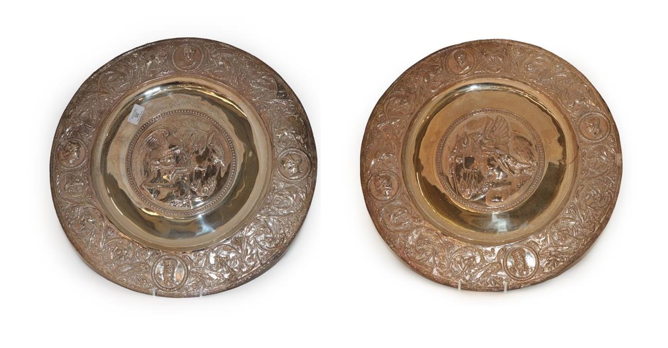 Lot 35 - A Pair of Silver Plate Sideboard-Dishes, each circular, chased with a classical figure in the...