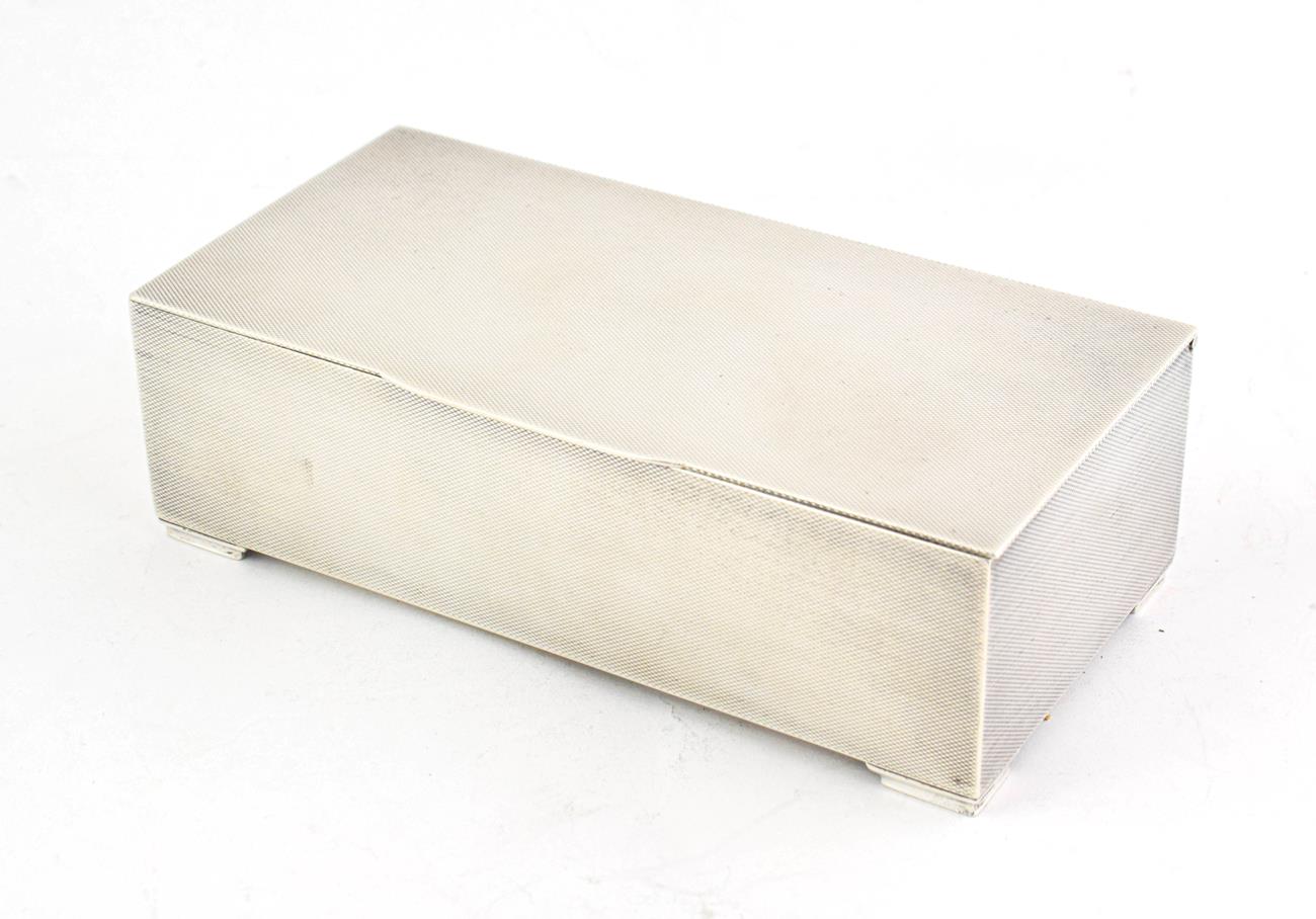 Lot 52 - A George VI Silver Cigarette-Box, by Padgett and Braham Ltd., London, 1938, oblong, the sides...