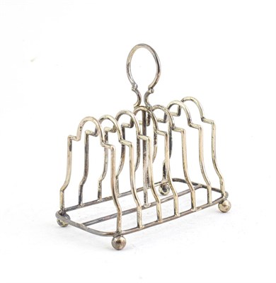 Lot 60 - An Edward VII Silver Toast rack, by William Aitken, Birmingham, 1902, oblong and on four ball feet