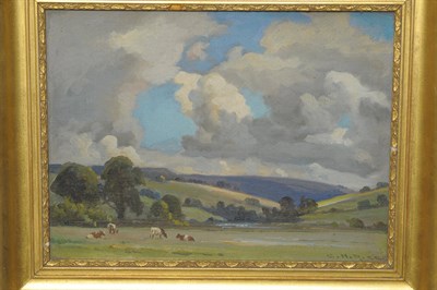 Lot 955 - Ernest Higgins Rigg (1868-1947)  Summer pasture with cattle grazing in the foreground Signed,...