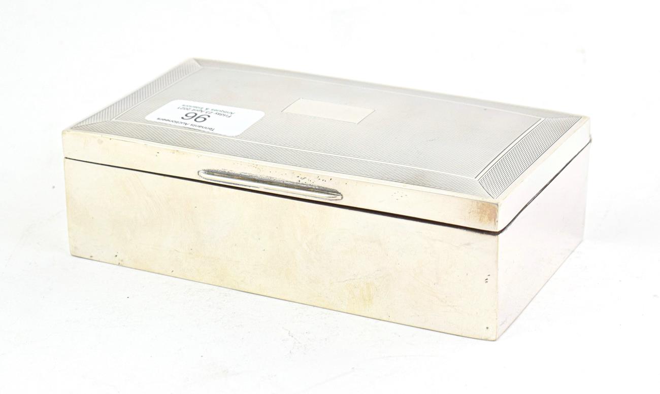 Lot 96 - An Elizabeth II Silver Cigarette-Box, by Harman Brothers, Birmingham, 1953, oblong, the hinged...