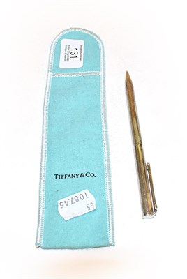 Lot 131 - A Tiffany silver ballpoint-pen, in Tiffany bag, the pen 13.5cm long