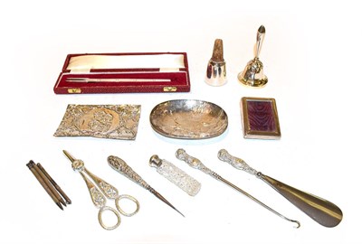 Lot 133 - A collection of assorted silver, comprising: a table-bell; a pair of grape scissors; a sucket...