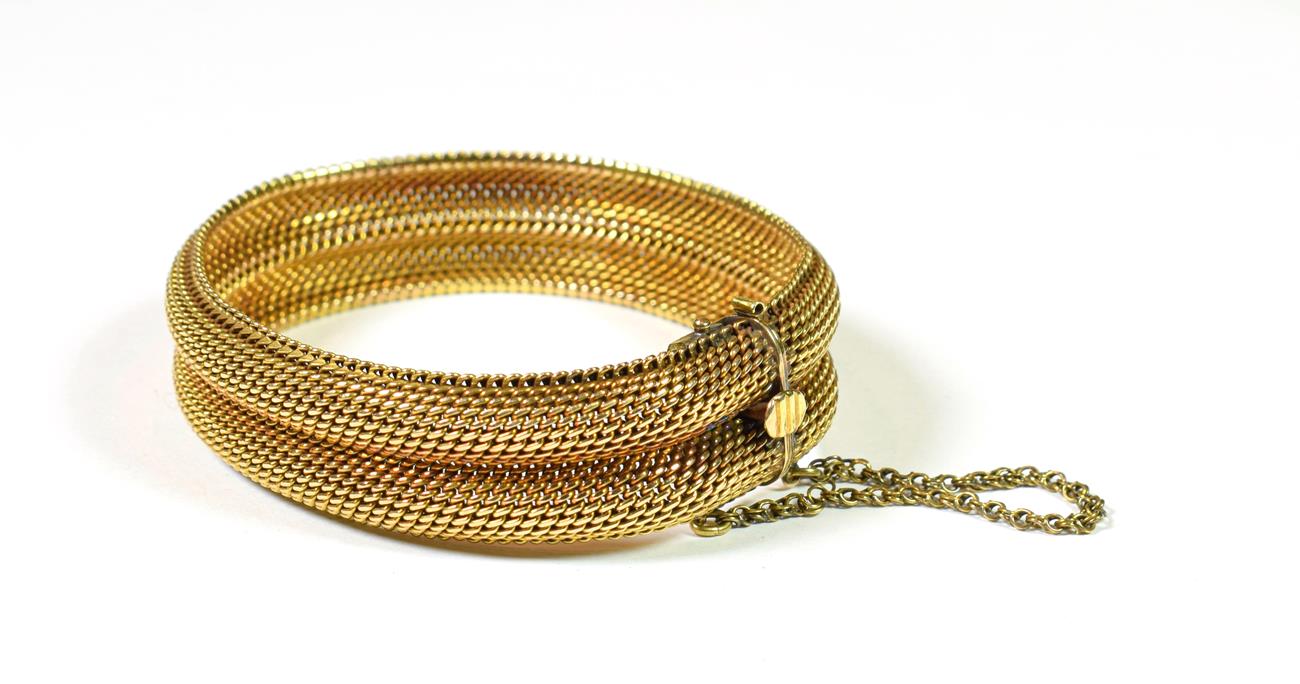 Lot 140 - A double row mesh bracelet, stamped '585', length 20cm