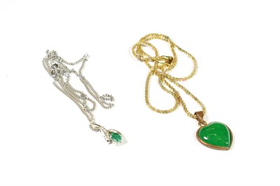 Lot 144 - An emerald and diamond pendant on a 9 carat white gold chain, chain length 46cm; and a heart shaped