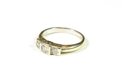 Lot 152 - A 9 carat white gold diamond three stone ring, finger size M