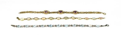 Lot 162 - A 9 carat white gold blue topaz bracelet, length 19.5cm; a 9 carat gold mother-of-pearl...