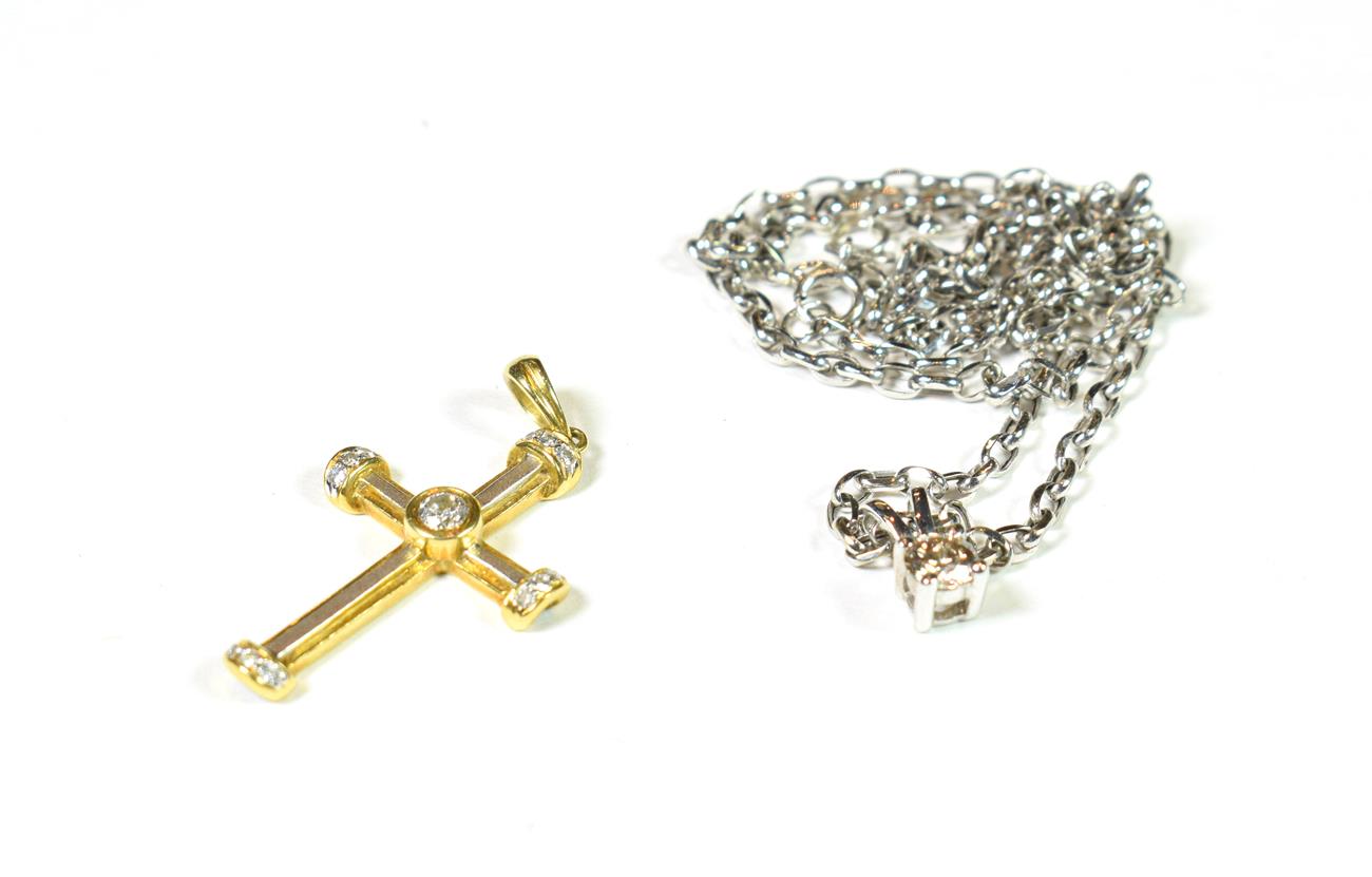 Lot 164 - A diamond cross pendant, stamped '750', length 3.1cm; and a 9 carat gold diamond solitaire...