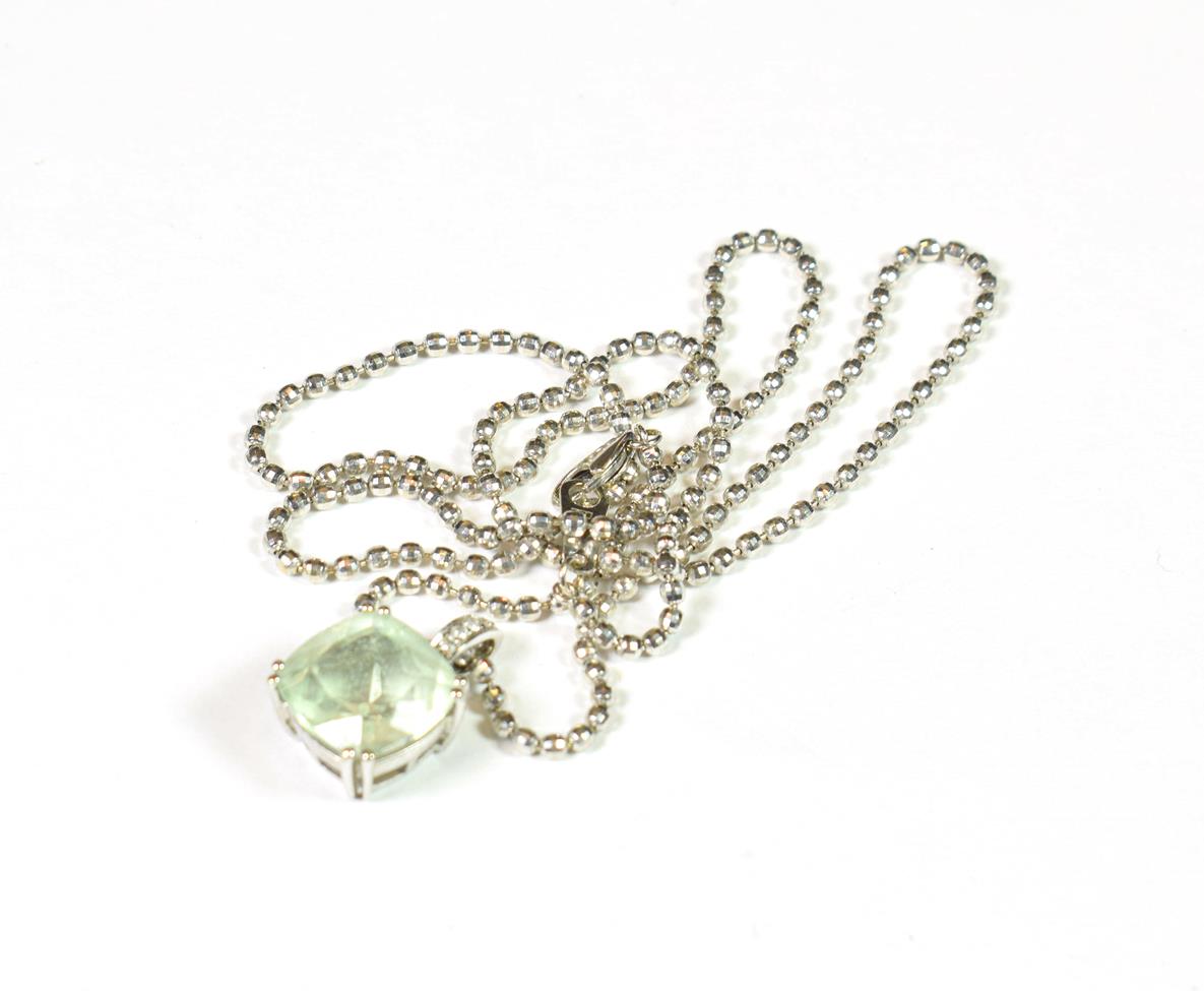 Lot 167 - A 9 carat gold quartz and diamond pendant on a bead link chain, chain length 50.5cm