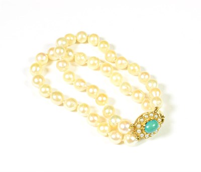Lot 170 - A double strand cultured pearl bracelet, with a turquoise and split pearl clasp, length 20cm