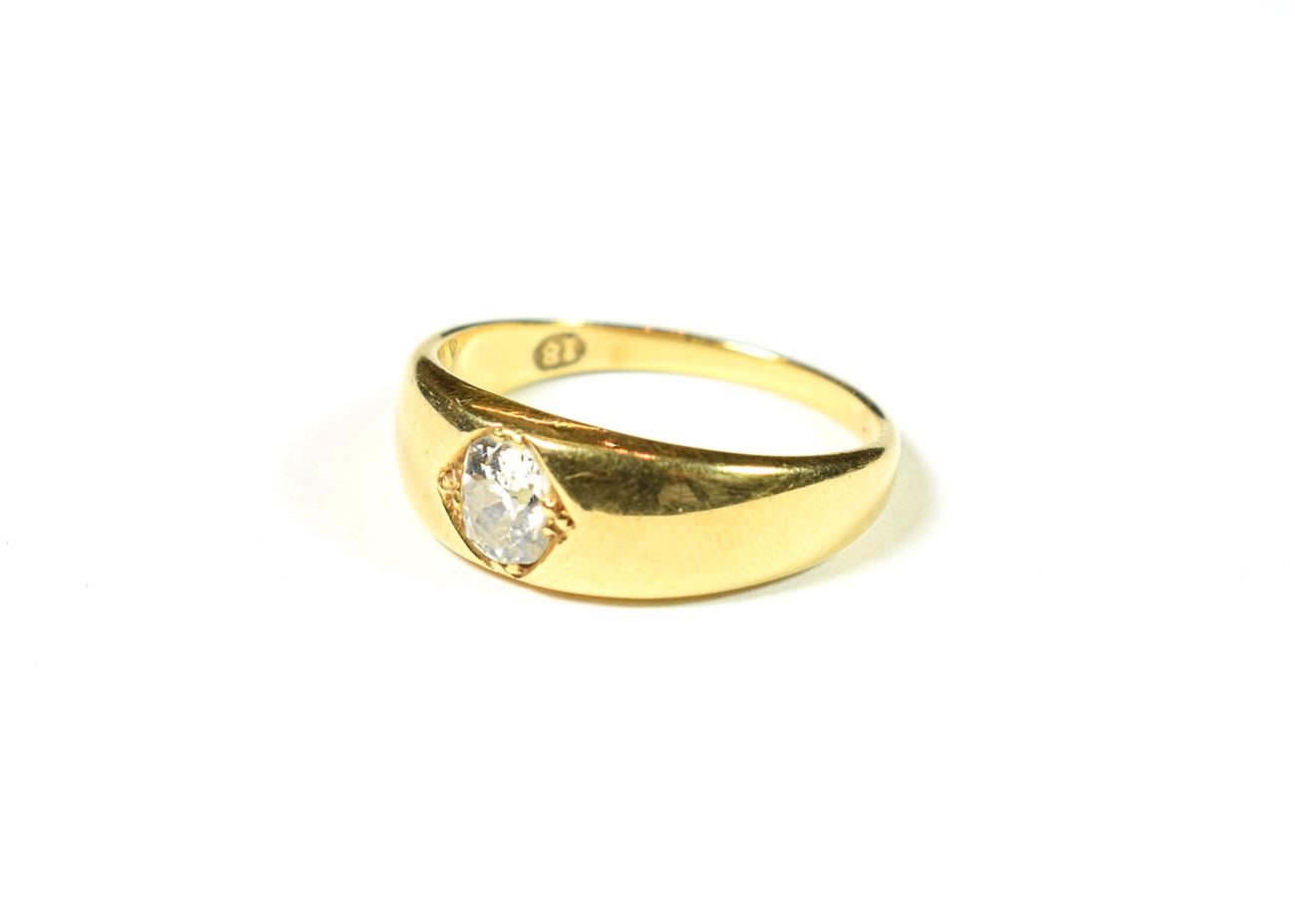 Lot 175 - A diamond solitaire ring, the cushion cut diamond in a yellow claw setting, to a plain polished...