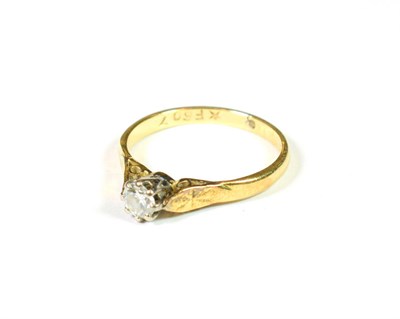 Lot 179 - A diamond solitaire ring, the round brilliant cut diamond in a white claw setting, to a yellow...