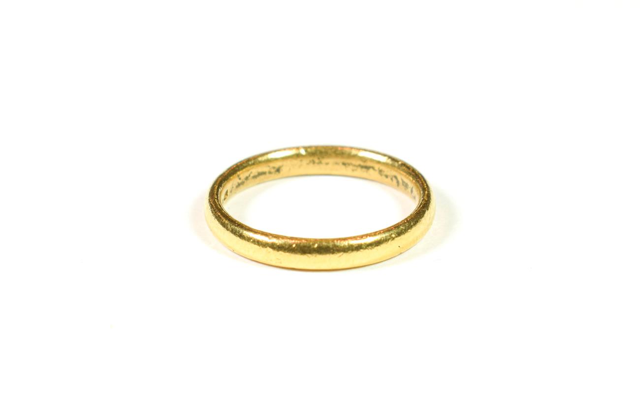 Lot 184 - A 22 carat gold band ring, finger size M