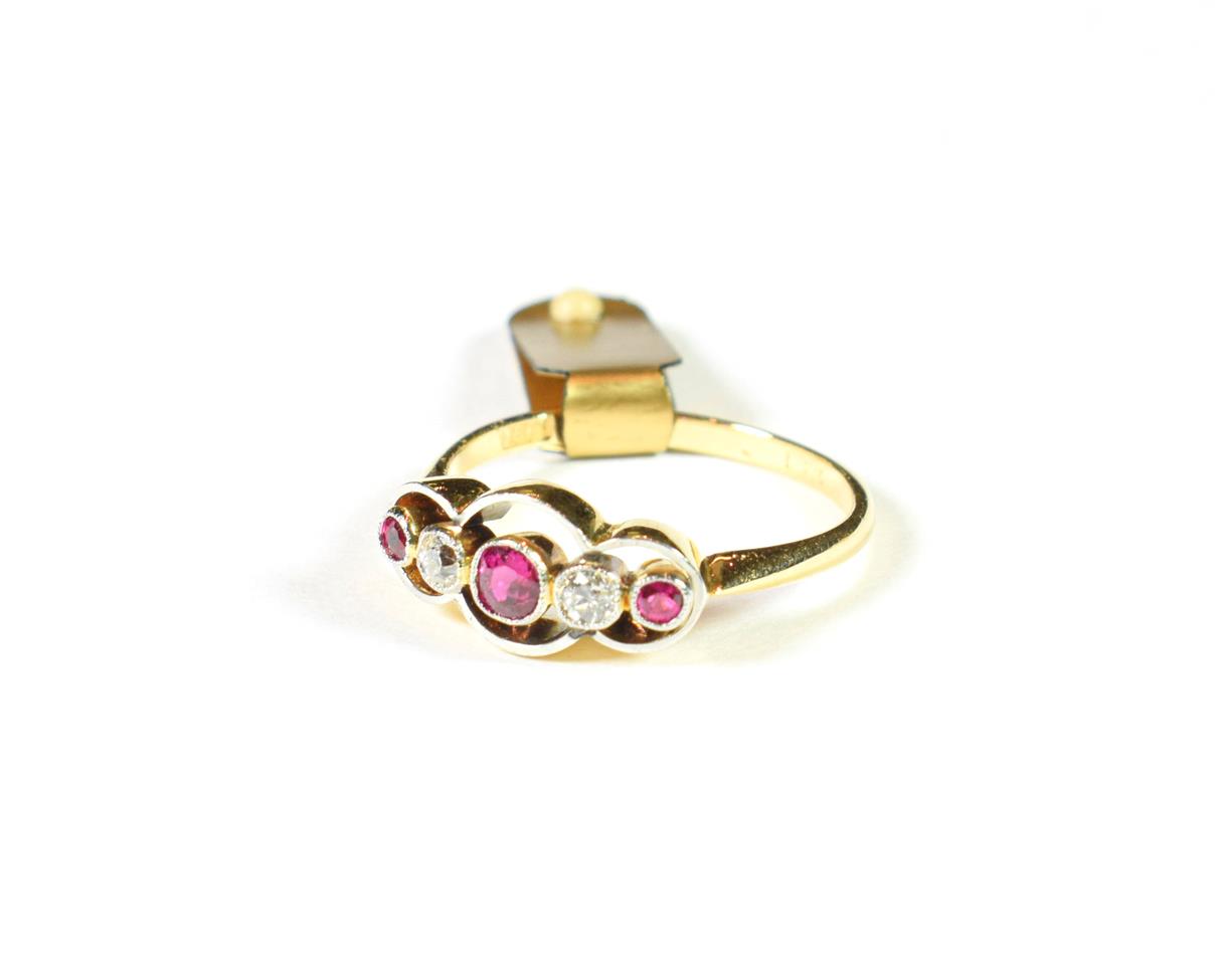 Lot 203 - A synthetic ruby and diamond five stone ring, three graduated round cut rubies alternate with...