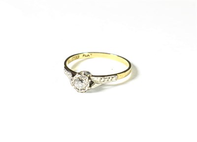 Lot 215 - A diamond solitaire ring, the old cut diamond in a white rubbed over setting, to a textured...
