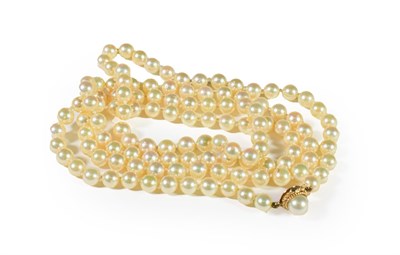 Lot 216 - A cultured pearl necklace knotted to a 9 carat gold clasp, length 98cm