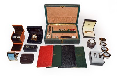 Lot 221 - Four Smythson items including a sterling-mounted jotter, two Links alarm clocks in leather...