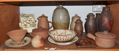 Lot 232 - A shelf of studio pottery including Leach standard wares, five Raku glazed jars (three lidded)...