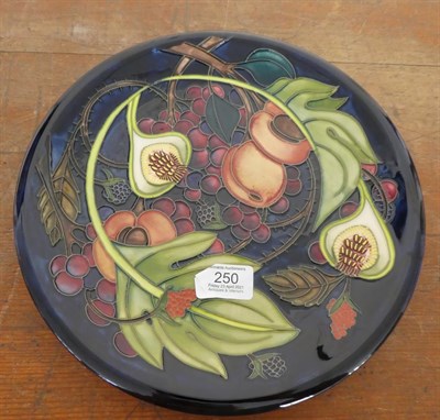 Lot 250 - A Moorcroft Queens Choice pattern plate, shape 85/11, designed by Emma Bossons, impressed...