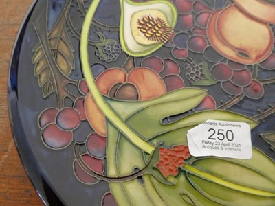 Lot 250 - A Moorcroft Queens Choice pattern plate, shape 85/11, designed by Emma Bossons, impressed...