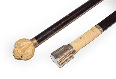 Lot 263 - A Japanese ivory mounted walking stick, Meiji period, the handle carved as a Parrot 91cm, and a...