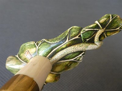 Lot 271 - A Japanese stained ivory mounted walking stick Meiji period, the handle carved as a pair of Koi...