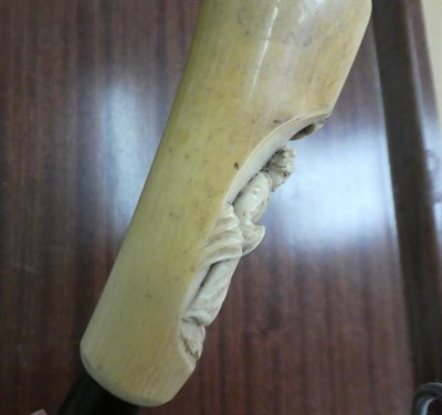 Lot 272 - A Chinese ivory mounted walking stick, late 19th century, the handle carved with a figure,...