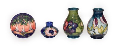 Lot 306 - Four pieces of Moorcroft pottery, Anemone squat vase, Clematis vase, contemporary Magnolia vase and
