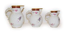 Lot 334 - A set of Coalport graduated jugs, tallest 20cm