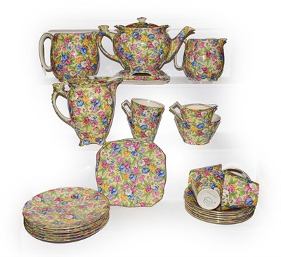 Lot 351 - A Royal Winton chintz Sweet Pea six place tea set, comprising teapot and over on stand, hot...
