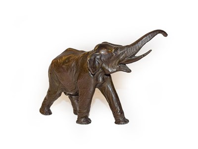 Lot 366 - A patinated bronze model of an elephant, 9cm high by 14cm wide