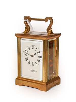 Lot 379 - A brass cased carriage timepiece, dial signed Garrard & Co. Ltd. in original box, 14.75cm